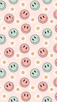 a pink background with smiley faces and daisies on the bottom, in different colors