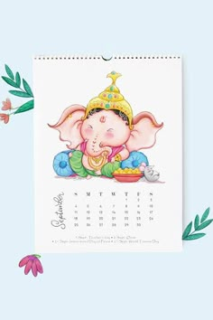 an elephant with a crown on it's head sitting in front of a calendar