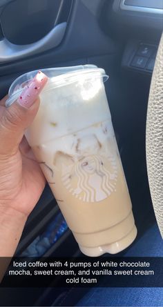 a person holding up a cup of iced coffee with 4 pumps of white chocolate mocha, sweet cream, and vanilla sweet cream