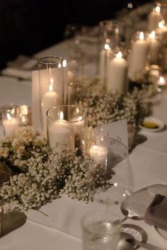 a table with candles and flowers on it