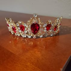 Handmade Gold White And Red Rhinestone Crown. I Bought For My Daughters Disney Themed Wedding. She Went With Another One Instead So This Beautiful Piece Was Never Worn. It Is Absolutely Beautiful In Person Red Crown For Quinceanera, Red And Gold Roses Quinceanera Theme, Red Quinceanera Tiara, Quinceanera Decorations Red And Gold, Gold Crown With Red Jewels, Red Quince Crown Gold, Red Wedding Accessories, Red And Gold Heels Quince, Red Quince Jewelry