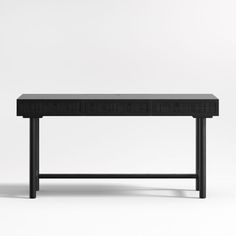 a black table sitting on top of a white floor