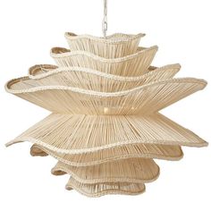 a light fixture made out of straw with an intricate design on the top and bottom