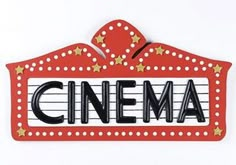 a red sign that says cinema with stars on the top and bottom, in front of a white background