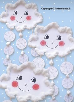 paper plate clouds with faces on them and snowflakes hanging from the ceiling in the background