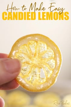 a hand holding an orange slice with the words how to make easy candied lemons