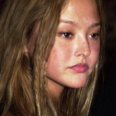 a close up of a person with long hair