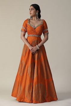 Burnt orange anarkali featuring foil printed mandala motifs, pleated bodice embellished by sequins and shell tassels. Comes with fringe lace lined dupatta. - Aza Fashions Orange Cutdana Kurta For Navratri, Orange Anarkali Churidar With Zari Work, Designer Orange Kurta With Pallu, Orange Anarkali Set For Eid With Traditional Drape, Orange Chanderi Anarkali Set For Navratri, Designer Wear Orange Floor-length Sharara, Designer Floor-length Orange Sharara, Orange Floor-length Sharara, Orange Chanderi Anarkali Set With Cutdana