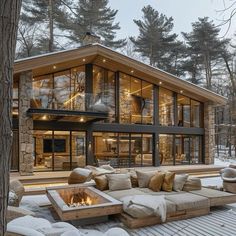 an outdoor living area with couches and fire pit