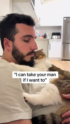 a man holding a cat in his arms with the caption'i can take your man if i want to '