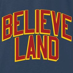 the words believe land in red and yellow on a dark blue t - shirt that says believe