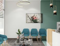 a living room with blue chairs and a painting hanging on the wall above it's glass coffee table