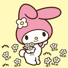 hello kitty holding flowers in her hand and wearing a pink bunny hat with ears on it