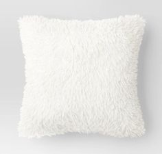 a white fluffy pillow on a gray background