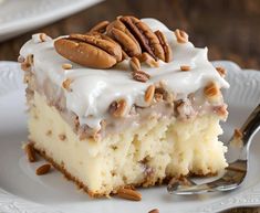 a piece of cake with pecans on top