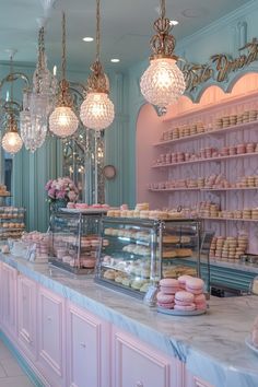 a bakery filled with lots of different types of cakes and cupcakes on display