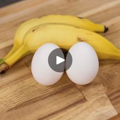 an egg and two bananas on a wooden table