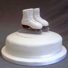 a white cake with ice skates on top