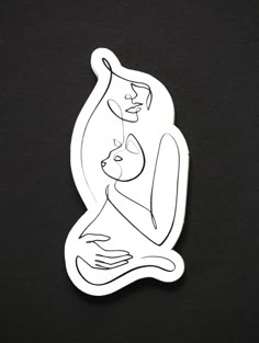 a white sticker with a drawing of a woman holding a cat on it's back