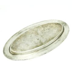 an oval silver tray on a white background