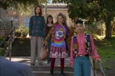 three women are walking down the stairs together