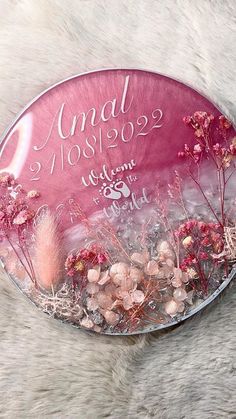 a pink plate with flowers on it that says amal mos092