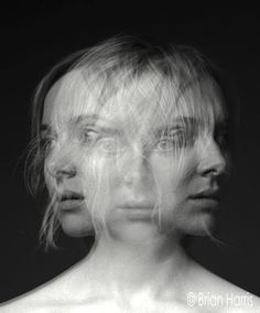 black and white photograph of two women's faces with hair blowing in the wind