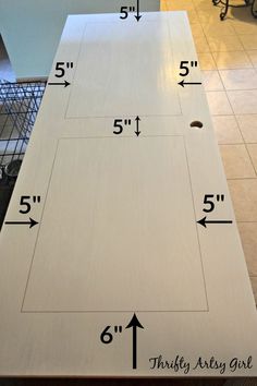 the measurements for an unfinished cabinet door are shown in front of a tile floor with a basket