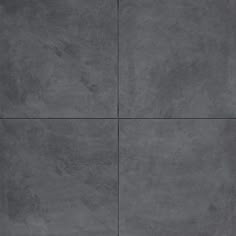 a gray tile floor with four squares in the middle