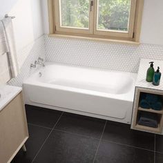 a white bath tub sitting next to a window