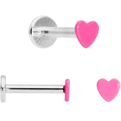 two pink hearts are attached to the back of a pair of screws