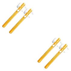 three yellow toothbrushes sitting next to each other on top of a white surface