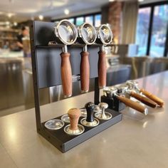 an assortment of kitchen utensils on display in a restaurant