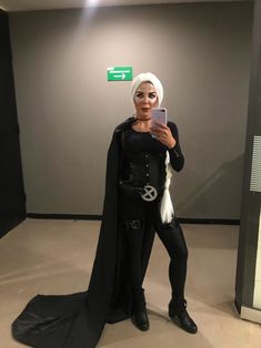 a woman dressed in costume taking a selfie