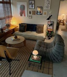 a living room filled with furniture and pictures on the wall