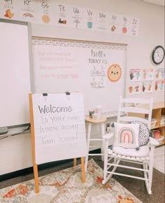 a welcome sign is in front of a whiteboard