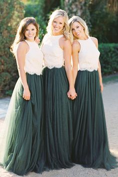 three women in long green dresses standing next to each other with their hands on their hips