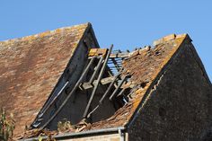 the roof of an old brick building that has been gutted