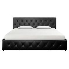 a bed with black leather headboard and white sheets on top of it, in front of a white background