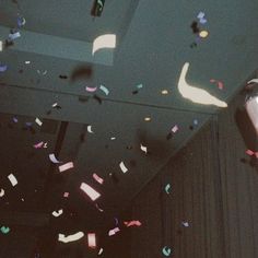 a ceiling with confetti and streamers falling from the ceiling to the floor