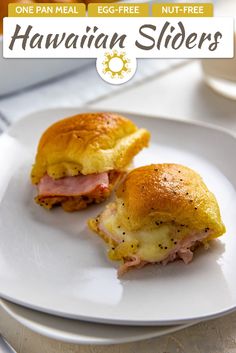 two ham and cheese sliders on a white plate