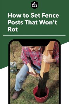 a man sitting on the ground with his feet in a bucket while holding onto a pole