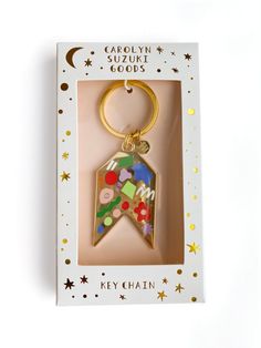 a keychain with an image of a star on it in a card box