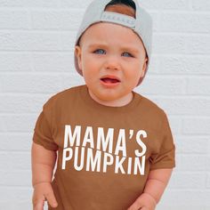 Mama's Pumpkin , Pumpkin Patch Shirt , Pumpkin Head , Pumpkin Shirt , Toddler Shirt , Baby Shirt , Fall Shirts , Fall Toddler Shirts G A R M E N T ∙ F E A T U R E S : * Uniquely soft fabric * Modern, unisex fit * Crew neck and short sleeves - Has a great comfortable fit you are sure to love F I T ∙ & ∙ S I Z I N G * Please consult size chart in pics for accurate fit. Please keep in mind that there are always slight variations in sizing. - Remember unisex tee's fit on the bigger side. F A B R I C Cute Family Shirt With Letter Print, Brown Long Sleeve Tops For Playtime, Cute Fall T-shirt For Playtime, Cute Family Shirt With Name Print, Cute Brown Tops For Playtime, Fall Playtime Tops With Short Sleeves, Brown Cotton Tops With Letter Print, Unisex Letter Print Tops For Fall, Cotton Tops With Letter Print For Playtime