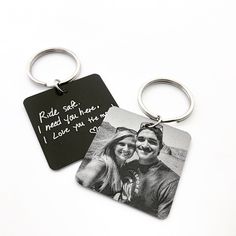 two key chains that have pictures on them