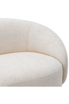 a white couch with a curved back and arms