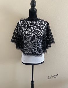 Good quality embroidered heavy thick lace Capelet . Beautiful look with a dress or jeans. Elegant black color. Made in USA Size: S, M ,L ,XL (small, medium, large, extra large ) Black Scalloped Lace Top For Evening, Black Scalloped Lace Top, Black Lace Top For Party With Lace Work, Embroidered Lace Top For Wedding, Black Spring Wedding Tops, Elegant Black Crochet Lace Tops, Black Lace Top With Crochet Details, Short Sleeve Crochet Lace Top, Black Lace Top With Lace Work