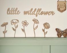 there is a sign that says little wildflower on the wall