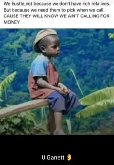 a young boy sitting on top of a wooden bench in front of a lush green forest