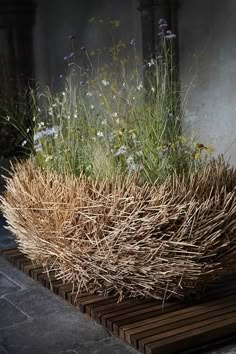 the planter is made out of sticks and grass